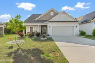 587 Meadowbrook Lane NW, Calabash, NC 28467 — 3-bedroom home in Meadowlands, Calabash, NC, photo 1 of 43: Front