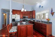 102 Freeman Lane, Atlantic Beach, NC 28512 — 3-bedroom home in Club Colony, Atlantic Beach, NC, photo 6 of 64: Kitchen with Island