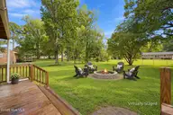 5203 Meadowbrook Drive, Trent Woods, NC 28562 — 3-bedroom home in Country Club Park, Trent Woods, NC, photo 8 of 61: Fire pit view from Deck