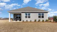 1220 Sandy Heights Loop Lot 149, Navassa, NC 28451 — 3-bedroom home in Cedar Hill Landing, Navassa, NC, photo 24 of 39: Back of home