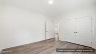 159 Branch Canal Road, New Bern, NC 28560 — 3-bedroom home, New Bern, NC, photo 11 of 23: 13_modern_minimalist_room_with_wood_floo
