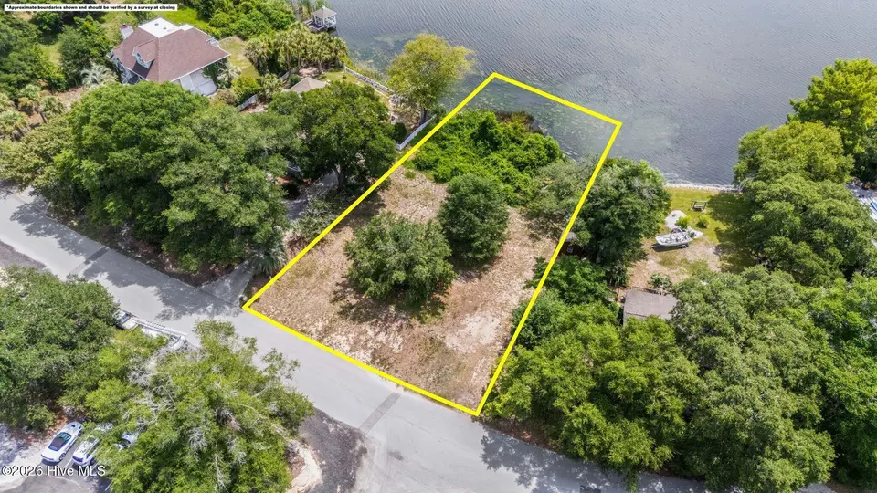 621 Lakeshore Drive, Sunset Beach, NC 28468 — waterfront lot in Twin Lakes, Sunset Beach, NC, photo 1 of 14