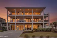 1423 N Shore Drive, Surf City, NC 28445 — 5-bedroom waterfront home in Del Mar Beach, Surf City, NC, photo 3 of 75: 1423NShore_Front_Dusk