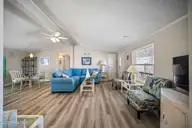 9105 W 9th Street, Surf City, NC 28445 — 3-bedroom waterfront manufactured home in Old Settlers Beach, Surf City, NC, photo 14 of 60: living room2- 9105 9th St - Listing -13