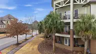 561 Garden Terrace Drive 203, Wilmington, NC 28405 — 3-bedroom condo in The Village at Mayfaire, Wilmington, NC, photo 3 of 43: 5_dji_20260221115608_0029_d