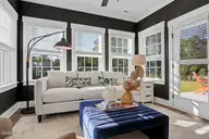 591 Heart Pine Avenue, Wilmington, NC 28411 — 4-bedroom home in Indigo at Abbey Preserve, Wilmington, NC, photo 13 of 31: Sunroom 2 - Nantanaha - Cottages at Brad
