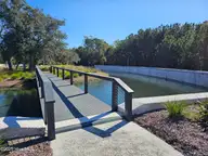 545 Glitter Bay Loop, Shallotte, NC 28470 — 4-bedroom home in Solserra, Shallotte, NC, photo 5 of 5: Front Island bridge