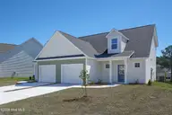 215 Sandpiper Place, Holly Ridge, NC 28445 — 3-bedroom townhome in Coastal Village, Holly Ridge, NC, photo 3 of 20: 213.215 Sand Piper - Exterior - Edited_4