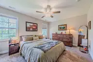107 Village Drive, Holly Ridge, NC 28445 — 4-bedroom home in Coastal Village, Holly Ridge, NC, photo 23 of 77: Primary bedroom