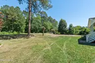 13290 New Britton Highway E, Nakina, NC 28455 — 3-bedroom home, Nakina, NC, photo 7 of 74: Large Flat Yard