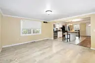 2715 Castle Hayne Road, Wilmington, NC 28401 — 3-bedroom home, Wilmington, NC, photo 11 of 34: Living Room to Kitchen