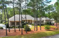 68 Abbottsford Drive, Pinehurst, NC 28374 — 4-bedroom home in Pinewild CC, Pinehurst, NC, photo 1 of 53: drone-1