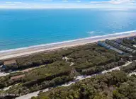 104 Lot 7 7 Roosevelt Reserve Park Place, Pine Knoll Shores, NC 28512 — waterfront lot in Roosevelt Reserve, Pine Knoll Shores, NC, photo 1 of 11: Where Maritime Forest Meets the Atlantic