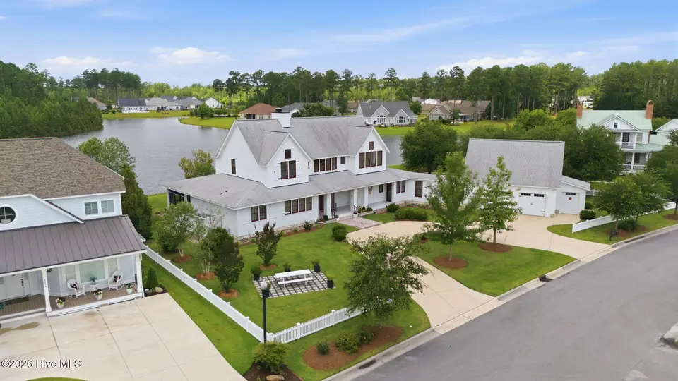 4030 Reunion Pointe Lane, New Bern, NC 28562 — 4-bedroom waterfront home in Carolina Colours, New Bern, NC, photo 1 of 73: 7-web-or-mls-DJI_20260617115734_0706_D