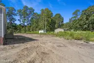 580 S Windward Drive SW, Supply, NC 28462 — 3-bedroom manufactured home in Ocean Trail II, Supply, NC, photo 24 of 32: Side Yard looking towards the Rear