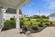 210 Knots Bend Drive, Hampstead, NC 28443 — 4-bedroom home in Salters Haven at Lea Marina, Hampstead, NC, photo 10 of 72: 12_front left porch