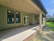 203 Gaston Drive, Elizabeth City, NC 27909 — 3-bedroom waterfront home in Newbegun Land, Elizabeth City, NC, photo 14 of 18: Covered Porch 2