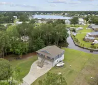 452 Crows Nest Lane, Sneads Ferry, NC 28460 — 3-bedroom waterfront home in Weston Lyall, Sneads Ferry, NC, photo 1 of 36: Screenshot 2025-06-06 at 3.34.56PM