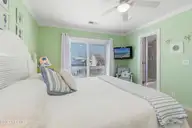 415 Sailfish Street, Sunset Beach, NC 28468 — 4-bedroom waterfront home in Sunset Beach, Sunset Beach, NC, photo 23 of 63: Primary Bedroom
