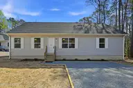 858 Wildwood Circle, Hampstead, NC 28443 — 3-bedroom waterfront home in Bay Harbor, Hampstead, NC, photo 1 of 43: 1_858_wildwood_cir_001