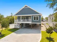 108 NE 64th Street, Oak Island, NC 28465 — 4-bedroom home in Tranquil Harbor, Oak Island, NC, photo 1 of 76