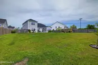 166 N Passerine Path, Hampstead, NC 28443 — 4-bedroom home in Songbird Landing, Hampstead, NC, photo 12 of 70: Backyard