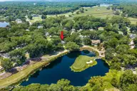 514 Woods Court SW, Sunset Beach, NC 28468 — 3-bedroom home in Sea Trail Plantation, Sunset Beach, NC, photo 10 of 50: 13-web-or-mls-9 overview with arrow