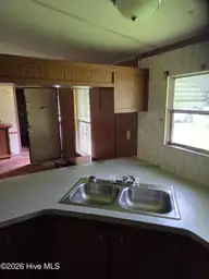 708 Elma Drive, Kinston, NC 28501 — manufactured home, Kinston, NC, photo 10 of 12: Kitchen sink and bar