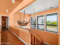 2604 S Shore Drive, Surf City, NC 28445 — 4-bedroom waterfront home in Channelbend, Surf City, NC, photo 23 of 73: Entryway Stairs