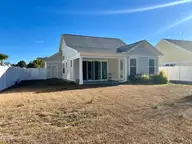 1558 Harbour Place Drive, Calabash, NC 28467 — 2-bedroom home in Kingfish Bay, Calabash, NC, photo 2 of 42: back of house