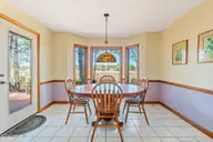 1461 S Shore Drive, Southport, NC 28461 — 3-bedroom waterfront home, Southport, NC, photo 15 of 75: Dining Room Looking Out