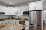 205 E Loon Court, Hampstead, NC 28443 — 3-bedroom home in Pelican Reef, Hampstead, NC, photo 12 of 68: kitchen-01c