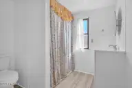 2387 Jolly Roger Drive SW, Supply, NC 28462 — 2-bedroom manufactured home in Buccaneer Hills, Supply, NC, photo 18 of 40: bathroom 1