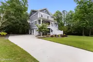 104 W High Bluff Drive, Hampstead, NC 28443 — 3-bedroom waterfront home in Pelican Reef, Hampstead, NC, photo 1 of 63