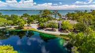 142 Lagoon Lane, Pine Knoll Shores, NC 28512 — 3-bedroom waterfront condo in Mcginnis Point, Pine Knoll Shores, NC, photo 10 of 41: Front Pond Aerial