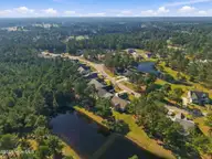1027 Crosby Circle SW, Sunset Beach, NC 28468 — 4-bedroom home in Ocean Ridge Plantation, Sunset Beach, NC, photo 22 of 33: Drone Pic 2