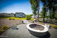 107 Saratoga Way, Rocky Point, NC 28457 — 4-bedroom home in Saratoga, Rocky Point, NC, photo 4 of 26: firepit