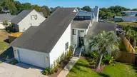 212 Teakwood Drive, Carolina Beach, NC 28428 — 3-bedroom waterfront home in Pleasure Cay, Carolina Beach, NC, photo 2 of 46: Front Elevation