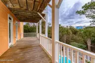 200 Shipwreck Lane, Emerald Isle, NC 28594 — 3-bedroom waterfront home in Spinnakers Reach, Emerald Isle, NC, photo 24 of 59: Covered porch off bedroom 2 & 3