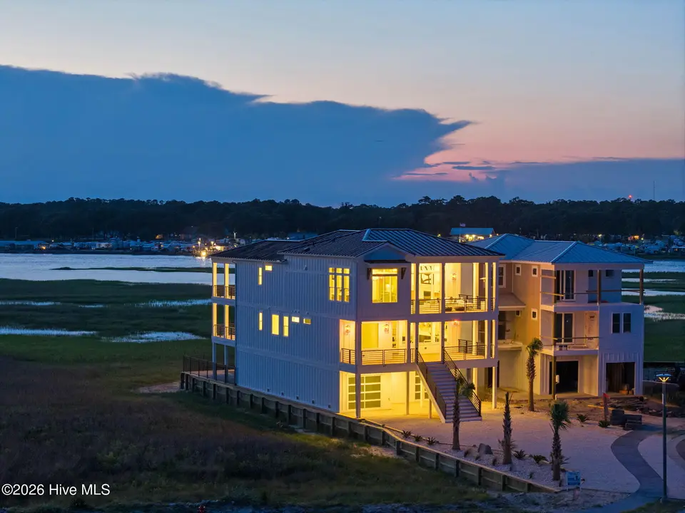 47 Grand View Drive, Ocean Isle Beach, NC 28469 — 8-bedroom waterfront home in The Pointe at Ocean Isle Beach, Ocean Isle Beach, NC, photo 1 of 71: www.kahunaphoto.com-DJI_20250628085524_0