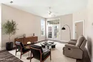 613 Elfin Court, Leland, NC 28479 — 2-bedroom townhome in Westport, Leland, NC, photo 5 of 28: Living Room Virtually Staged