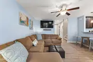 117 NE 19th Street, Oak Island, NC 28465 — 3-bedroom home in Tranquil Harbor, Oak Island, NC, photo 9 of 77: Living Room
