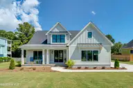 125 Cove Side Lane, Hampstead, NC 28443 — 4-bedroom waterfront home in Pelican Sound, Hampstead, NC, photo 1 of 29: 125CoveSideFinal-1