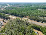 1287 Village Road NE, Leland, NC 28451 — lot, Leland, NC, photo 3 of 5: 1287 Village Rd and Hwy 74
