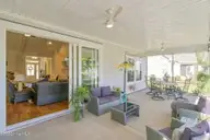 1027 Crosby Circle SW, Sunset Beach, NC 28468 — 4-bedroom home in Ocean Ridge Plantation, Sunset Beach, NC, photo 15 of 33: Back porch