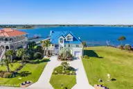 31 Osprey Drive, North Topsail Beach, NC 28460 — 3-bedroom waterfront home in Ocean Club Village, North Topsail Beach, NC, photo 1 of 56