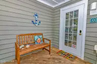 23 Ibis Roost, Bald Head Island, NC 28461 — 3-bedroom home in Ibis Roost, Bald Head Island, NC, photo 5 of 40: Covered Porch