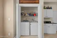 222 Pilothouse Place, Carolina Shores, NC 28467 — 3-bedroom condo in Beacon Townes, Carolina Shores, NC, photo 20 of 46: Laundry Closet