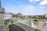 5127 W Beach Drive, Oak Island, NC 28465 — 5-bedroom waterfront home, Oak Island, NC, photo 17 of 73: 6_front porch