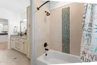 1404 W Yacht Drive, Oak Island, NC 28465 — 3-bedroom waterfront home in Pinners Point, Oak Island, NC, photo 18 of 46: Full bath shower